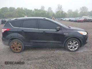 2014 Ford Escape Titanium with VIN 1FMCU9J90EUC24898, listed as a IAAI auction lot 42166523 with 152,464 mi miles and . Bid and sale history available at DreamBid. Image 13.