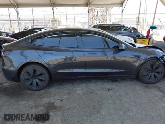 2025 Tesla Model 3 Long Range with VIN 5YJ3E1EA5SF978214, listed as a IAAI auction lot 42525444 with 6,489 mi miles and . Bid and sale history available at DreamBid. Image 14.