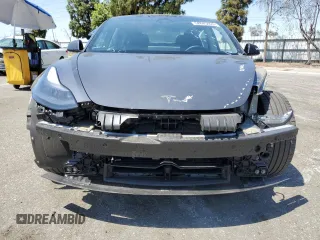 2023 Tesla Model 3 with VIN 5YJ3E1EA4PF615975, listed as a Copart auction lot 58845405 with 38,927 mi miles and Salvage title. Bid and sale history available at DreamBid. Image 5.