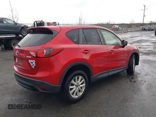 2014 Mazda CX-5 Touring with VIN JM3KE2CY2E0322211, listed as a IAAI auction lot 41721219 with 127,312 mi miles. Bid and sale history available at carsss.com. Image 4.