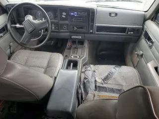 1989 Jeep Cherokee z VIN 1J4FT28LXKL601505, wystawiony jako Copart lot #49312265 z przebiegiem 264 769 mil mil oraz Szkoda całkowita • Salvage title. Historia ofert i sprzedaży dostępna na DreamBid. Obrazek 8.