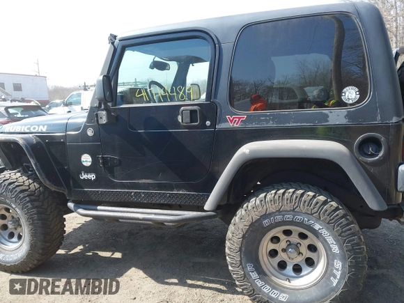 2004 Jeep Wrangler Rubicon with VIN 1J4FA69S64P789308, listed as a IAAI auction lot 41714489 with 186,302 mi miles. Bid and sale history available at carsss.com. Image 14.