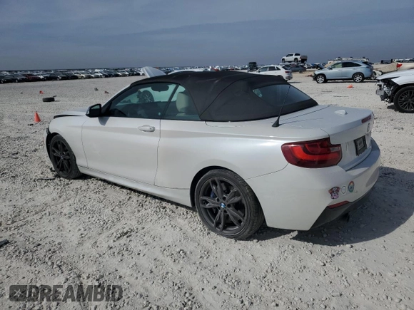 2016 BMW 2 Series M235i with VIN WBA1M1C52GV394052, listed as a Copart auction lot 82261594 with 83,979 mi miles and Salvage Title. Bid and sale history available at carsss.com. Image 2.