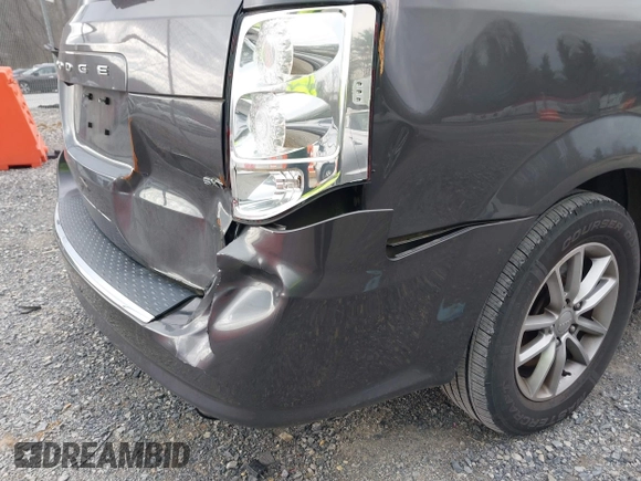 2014 Dodge Grand Caravan SXT with VIN 2C4RDGCG6ER376714, listed as a IAAI auction lot 41828025 with 172,285 mi miles and . Bid and sale history available at DreamBid. Image 6.