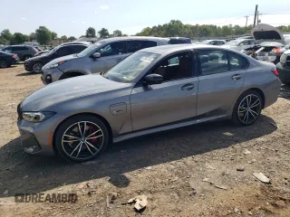 2023 BMW 3 Series 330e xDrive with VIN 3MW39FS02P8D01319, listed as a Copart auction lot 67836734 with 12,883 mi miles and Salvage Title. Bid and sale history available at carsss.com. Image 1.