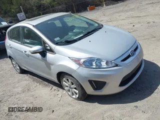 2013 Ford Fiesta SE with VIN 3FADP4EJ3DM136332, listed as a IAAI auction lot 42142556 with 69,979 mi miles. Bid and sale history available at carsss.com. Image 1.