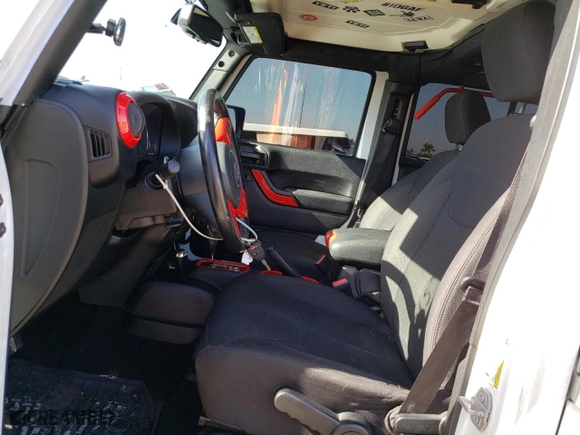 2018 Jeep Wrangler JK Unlimited Sport S with VIN 1C4BJWDG2JL889254, listed as a Copart auction lot 36729153 with 130,625 mi miles. Bid and sale history available at carsss.com. Image 7.