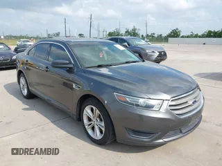 2015 Ford Taurus SE z VIN 1FAHP2D82FG145721, wystawiony jako IAAI lot #42163609 z przebiegiem 157 503 mil mil oraz . Historia ofert i sprzedaży dostępna na DreamBid. Obrazek 1.