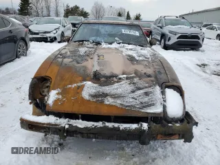 1979 Datsun 280ZX z VIN HS130137808, wystawiony jako Copart lot #43799165 z przebiegiem 28 995 mil mil oraz Tytuł czysty. Historia ofert i sprzedaży dostępna na DreamBid. Obrazek 5.