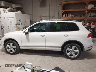 2011 Volkswagen Touareg Sport with VIN WVGFF9BP8BD004747, listed as a IAAI auction lot 41780515 with 159,228 mi miles and . Bid and sale history available at DreamBid. Image 14.