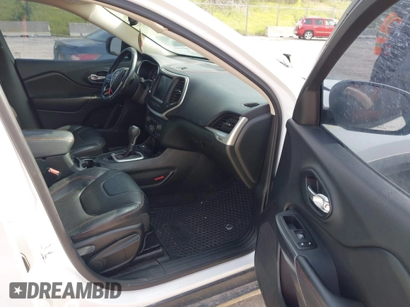 2015 Jeep Cherokee Trailhawk with VIN 1C4PJMBS6FW687718, listed as a IAAI auction lot 42505169 with 122,526 mi miles and . Bid and sale history available at DreamBid. Image 5.
