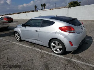2014 Hyundai Veloster with VIN KMHTC6AD2EU186726, listed as a Copart auction lot 43993215 with 120,591 mi miles and Salvage Title. Bid and sale history available at carsss.com. Image 2.