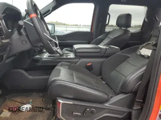 2023 Ford F-150 Raptor with VIN 1FTFW1RG4PFB17389, listed as a Copart auction lot 51703635 with 19,772 mi miles and Salvage Title. Bid and sale history available at DreamBid. Image 7.