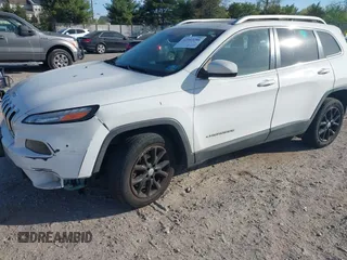 2015 Jeep Cherokee Latitude with VIN 1C4PJLCS6FW689607, listed as a IAAI auction lot 42103286 with 142,479 mi miles. Bid and sale history available at carsss.com. Image 18.