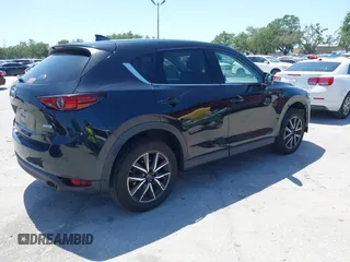 2017 Mazda CX-5 Grand Touring with VIN JM3KFBDL6H0200830, listed as a IAAI auction lot 42005145 with 90,510 mi miles. Bid and sale history available at carsss.com. Image 4.