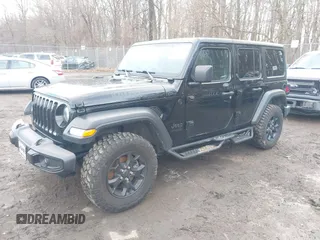 2022 Jeep Wrangler Unlimited Sport S with VIN 1C4HJXDG1NW141244, listed as a IAAI auction lot 41532388 with 27,829 mi miles. Bid and sale history available at carsss.com. Image 22.