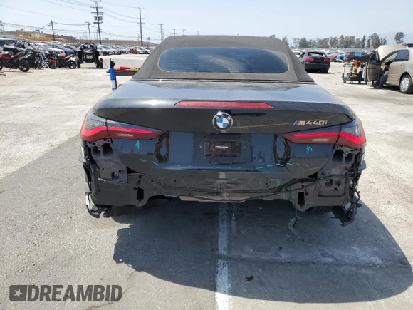 2022 BMW 4 Series M440i with VIN WBA53AT01NCJ52404, listed as a Copart auction lot 54464474 with 16,880 mi miles and Salvage title. Bid and sale history available at DreamBid. Image 6.