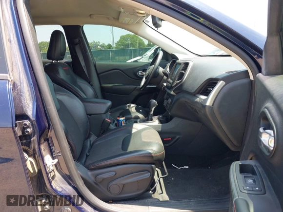 2015 Jeep Cherokee Trailhawk with VIN 1C4PJMBS3FW704622, listed as a IAAI auction lot 42465702 with 96,831 mi miles and . Bid and sale history available at DreamBid. Image 5.