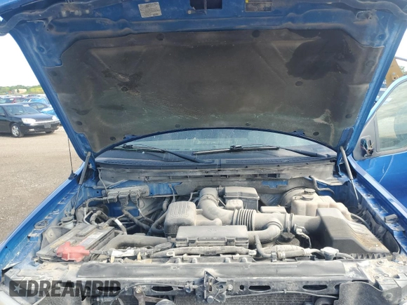 2009 Ford F-150 XL z VIN 1FTPX14V69FB16769, wystawiony jako Copart lot #57498575 z przebiegiem 168 162 mil mil oraz Szkoda całkowita • Salvage title. Historia ofert i sprzedaży dostępna na DreamBid. Obrazek 11.