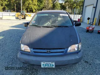 1999 Toyota Sienna LE with VIN 4T3ZF13C8XU108650, listed as a Copart auction lot 74476004 with 215,060 mi miles and Salvage Title. Bid and sale history available at carsss.com. Image 5.