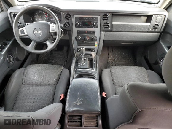 2010 Jeep Commander Sport with VIN 1J4RG4GK5AC119433, listed as a Copart auction lot 87657265 with 212,973 mi miles and Salvage title. Bid and sale history available at DreamBid. Image 8.