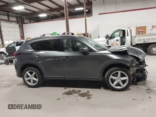 2020 Mazda CX-5 Grand Touring with VIN JM3KFBDM3L0739763, listed as a IAAI auction lot 41751250 with 88,063 mi miles and . Bid and sale history available at carsss.com. Image 13.
