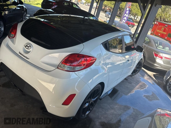 2012 Hyundai Veloster w/Red Int with VIN KMHTC6AD6CU036826, listed as a Copart auction lot 82190224 with 169,497 mi miles and Clean title. Bid and sale history available at DreamBid. Image 4.