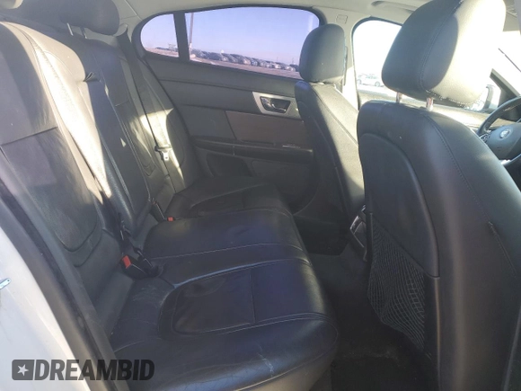 2015 Jaguar XF with VIN SAJXA0FS5FPU49437, listed as a Copart auction lot 84757254 with 99,301 mi miles and Salvage Title. Bid and sale history available at DreamBid. Image 10.