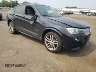 2015 BMW X4 xDrive35i with VIN 5UXXW5C59F0E87517, listed as a Copart auction lot 59604445 with 185,064 mi miles and Salvage title. Bid and sale history available at DreamBid. Image 4.