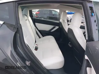 2018 Tesla Model 3 Long Range Battery with VIN 5YJ3E1EB9JF097118, listed as a IAAI auction lot 41619510 with 64,132 mi miles and . Bid and sale history available at DreamBid. Image 8.