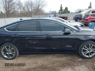 2019 Ford Fusion Hybrid Titanium with VIN 3FA6P0RU4KR144445, listed as a IAAI auction lot 42059840 with 90,617 mi miles. Bid and sale history available at carsss.com. Image 14.
