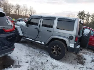 2015 Jeep Wrangler Unlimited Rubicon Hard Rock with VIN 1C4HJWFG1FL659803, listed as a IAAI auction lot 41172485 with 126,881 mi miles. Bid and sale history available at carsss.com. Image 3.