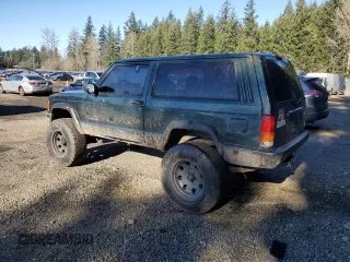 1999 Jeep Cherokee SE with VIN 1J4FF27S9XL667941, listed as a Copart auction lot 42429785 with 121,490 mi miles and Salvage title. Bid and sale history available at DreamBid. Image 2.