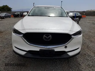 2018 Mazda CX-5 Grand Touring with VIN JM3KFADMXJ1358221, listed as a Copart auction lot 59746545 with 54,094 mi miles and Salvage title. Bid and sale history available at DreamBid. Image 5.