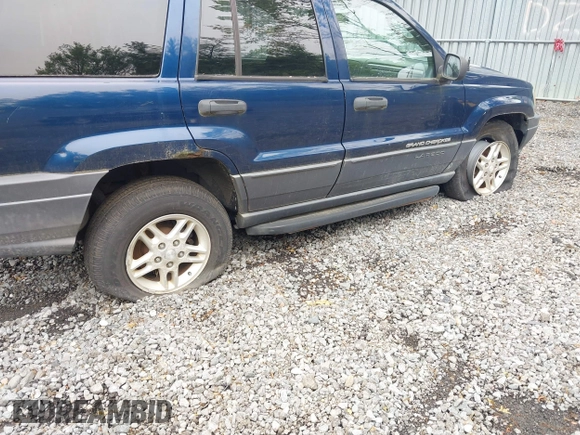 2003 Jeep Grand Cherokee Laredo z VIN 1J4GW48S73C553686, wystawiony jako IAAI lot #42278695 z przebiegiem 154 374 mil mil oraz . Historia ofert i sprzedaży dostępna na DreamBid. Obrazek 6.