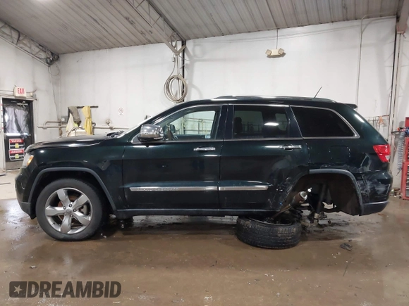 2013 Jeep Grand Cherokee Overland with VIN 1C4RJECT4DC526465, listed as a IAAI auction lot 41570663 with 116,948 mi miles. Bid and sale history available at carsss.com. Image 14.