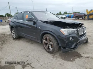 2015 BMW X4 xDrive28i with VIN 5UXXW3C51F0M88632, listed as a Copart auction lot 82401313 with 0 mi miles. Bid and sale history available at carsss.com. Image 4.