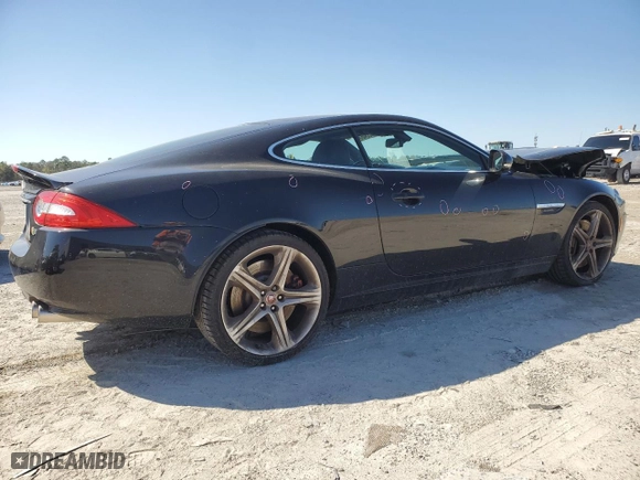 2015 Jaguar XK with VIN SAJWA4DCXFMB55227, listed as a Copart auction lot 48455465 with 64,050 mi miles and Salvage Title. Bid and sale history available at carsss.com. Image 3.