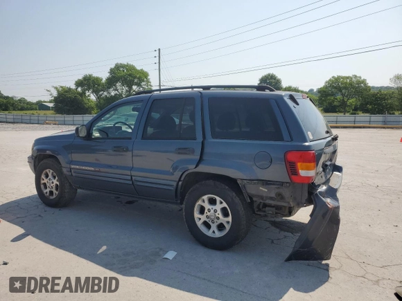 2002 Jeep Grand Cherokee Laredo with VIN 1J4GW48S92C319161, listed as a Copart auction lot 59304035 with 257,907 mi miles and Salvage title. Bid and sale history available at DreamBid. Image 2.