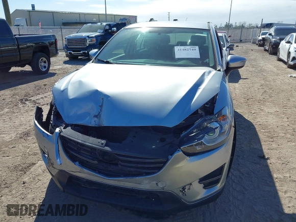 2016 Mazda CX-5 Sport with VIN JM3KE2BE9G0915168, listed as a IAAI auction lot 41482749 with 86,802 mi miles and . Bid and sale history available at carsss.com. Image 6.