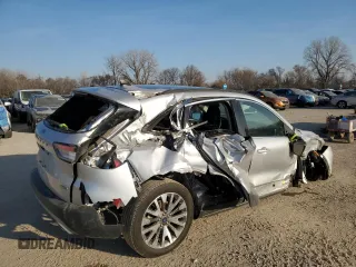 2020 Ford Escape Titanium Hybrid z VIN 1FMCU9DZ4LUC34827, wystawiony jako Copart lot #48769685 z przebiegiem 84 218 mil mil oraz Szkoda całkowita • Salvage title. Historia ofert i sprzedaży dostępna na DreamBid. Obrazek 3.