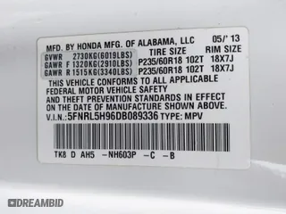 2013 Honda Odyssey Touring with VIN 5FNRL5H96DB089336, listed as a IAAI auction lot 41527990 with 128,770 mi miles. Bid and sale history available at carsss.com. Image 9.
