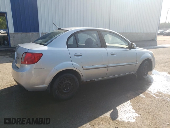 2011 Kia Rio with VIN KNADH4B32B6915275, listed as a Copart auction lot 71546484 with 297,998 mi miles and Salvage Title. Bid and sale history available at DreamBid. Image 3.