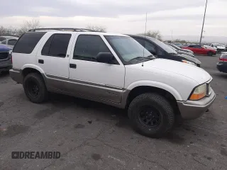 1999 GMC Jimmy SLE with VIN 1GKDT13W1X2551085, listed as a Copart auction lot 50553055 with 189,974 mi miles and Salvage Title. Bid and sale history available at carsss.com. Image 4.