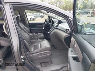 2013 Honda Odyssey Touring with VIN 5FNRL5H94DB013310, listed as a IAAI auction lot 42079565 with 128,622 mi miles and . Bid and sale history available at carsss.com. Image 5.