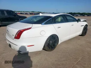 2014 Jaguar XJ Supercharged z VIN SAJWA1GT4EMV60053, wystawiony jako Copart lot #57643005 z przebiegiem 48 139 mil mil oraz Szkoda całkowita • Salvage title. Historia ofert i sprzedaży dostępna na DreamBid. Obrazek 3.