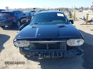2014 Dodge Challenger R/T z VIN 2C3CDYBT2EH313789, wystawiony jako IAAI lot #42020945 z przebiegiem 182 788 mil mil oraz . Historia ofert i sprzedaży dostępna na DreamBid. Obrazek 13.