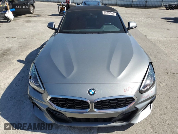 2024 BMW Z4 sDrive30i with VIN WBAHF3C06RWY36286, listed as a Copart auction lot 50296565 with 9,898 mi miles and Salvage title. Bid and sale history available at DreamBid. Image 5.