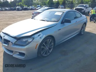 2013 BMW 6 Series 650i z VIN WBAYM9C57DDW20410, wystawiony jako IAAI lot #42348010 z przebiegiem 146 985 mil mil oraz . Historia ofert i sprzedaży dostępna na DreamBid. Obrazek 2.