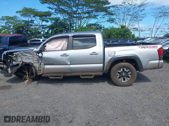 2018 Toyota Tacoma SR z VIN 3TMCZ5AN7JM156092, wystawiony jako IAAI lot #41642391 z przebiegiem 65 805 mil mil oraz . Historia ofert i sprzedaży dostępna na DreamBid. Obrazek 14.